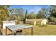 View of the home's backyard and the surrounding wooden fence at 7904 Empire Ave, Orlando, FL 32810