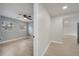 Bedroom with light gray walls, wood-look floors, two windows providing natural light, and a ceiling fan at 7904 Empire Ave, Orlando, FL 32810