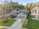 Aerial view of a well-maintained home showcasing its roof, landscaping, and curb appeal at 816 Garden Glen Loop, Lake Mary, FL 32746