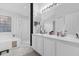 Bright bathroom featuring double sinks, a glass-enclosed shower, and a soaking tub at 816 Garden Glen Loop, Lake Mary, FL 32746