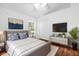 Cozy bedroom with hardwood floors, complemented by soothing colors and natural light at 816 Garden Glen Loop, Lake Mary, FL 32746