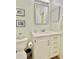 Bathroom vanity with ample drawer storage space and a decorative mirror at 8813 Dunes Ct # 7 201, Kissimmee, FL 34747