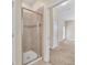 Stylish bathroom with a glass-enclosed shower and an entryway to the bedroom, offering convenience at 8946 Azalea Sands Ln # 8946, Davenport, FL 33896