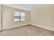 Cozy bedroom with neutral carpeting, a window with blinds, and a serene atmosphere at 8946 Azalea Sands Ln # 8946, Davenport, FL 33896