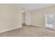 Bright bedroom featuring neutral carpet, a balcony door, and plenty of natural light at 8946 Azalea Sands Ln # 8946, Davenport, FL 33896