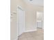 Entrance to the laundry room with washer and dryer adjacent to the entry door at 8946 Azalea Sands Ln # 8946, Davenport, FL 33896