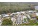 Aerial shot of a quiet, wooded community with well-kept homes and mature trees at 9000 Us Highway 192 # 896, Clermont, FL 34714