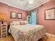 Cozy bedroom featuring light hardwood floors, a ceiling fan and neutral-colored walls at 9000 Us Highway 192 # 896, Clermont, FL 34714