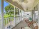 Enjoy outdoor living on this spacious porch with views of a lush green lawn at 9000 Us Highway 192 # 896, Clermont, FL 34714