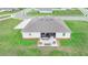 An aerial view shows a house and large, well-manicured lawn at 944 Lochland Loop, Bartow, FL 33830