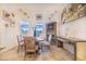 Bright dining area with natural light and stylish decor, perfect for Gathering meals and entertaining at 944 Lochland Loop, Bartow, FL 33830