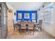 Dining room showcasing a dining table with six chairs, modern art, and natural light at 944 Lochland Loop, Bartow, FL 33830