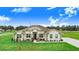 Charming single-story home featuring stone accents and a well-manicured lawn at 944 Lochland Loop, Bartow, FL 33830