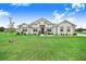 Beautiful single-story home featuring stone accents and a well-manicured lawn at 944 Lochland Loop, Bartow, FL 33830