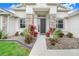 Inviting entryway with stone accents and decorative landscaping at 944 Lochland Loop, Bartow, FL 33830