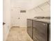 Well-equipped laundry room with modern washer and dryer units and a wire shelf at 944 Lochland Loop, Bartow, FL 33830