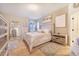 Comfortable main bedroom featuring neutral colors, soft textures, and ample natural light at 944 Lochland Loop, Bartow, FL 33830