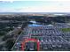 Aerial view of a residential community with a pond at 1042 Heirloom Dr, Haines City, FL 33844
