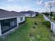 Expansive backyard with a white fence, offering privacy and landscaping possibilities at 1042 Heirloom Dr, Haines City, FL 33844