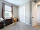 Bright bedroom features window, curtains, closet, dresser and carpeted floors at 1042 Heirloom Dr, Haines City, FL 33844