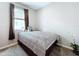 Simple bedroom with carpet, natural light, and a cozy atmosphere at 1042 Heirloom Dr, Haines City, FL 33844