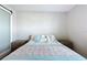 This calming bedroom features a patterned bed, side tables, and a sliding door at 1042 Heirloom Dr, Haines City, FL 33844