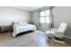 Bedroom features a bed, chair, and tiled floors at 1042 Heirloom Dr, Haines City, FL 33844