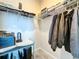 Organized walk-in closet featuring shelving, hanging rods, and ample space at 1042 Heirloom Dr, Haines City, FL 33844