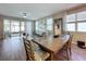 Open concept dining room with tile flooring and sliding glass doors leading to the outdoors at 1042 Heirloom Dr, Haines City, FL 33844