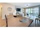 Open concept dining area with tile flooring and sliding glass doors to the patio at 1042 Heirloom Dr, Haines City, FL 33844