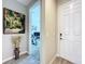 Welcoming entryway with stylish decor and a view into a home office space at 1042 Heirloom Dr, Haines City, FL 33844
