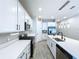 Modern kitchen featuring stainless steel appliances, white cabinets, and a gas range at 1042 Heirloom Dr, Haines City, FL 33844