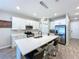 Modern kitchen features a large island, stainless steel appliances, and white cabinetry at 1042 Heirloom Dr, Haines City, FL 33844
