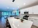 Bright kitchen with a large island, stainless steel appliances, and a connected dining area at 1042 Heirloom Dr, Haines City, FL 33844