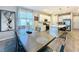 Open concept with kitchen and dining area with natural lighting and tile flooring at 1042 Heirloom Dr, Haines City, FL 33844