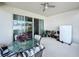 Covered patio features a ceiling fan and an outdoor dining set, perfect for relaxing or entertaining guests at 1042 Heirloom Dr, Haines City, FL 33844