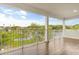 Inviting balcony showcasing a beautiful lake view, perfect for relaxing and enjoying the scenery at 1062 Hidden Dr, Lakeland, FL 33809