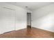 Bedroom with closet and wood-look tile flooring at 1062 Hidden Dr, Lakeland, FL 33809