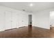 Empty bedroom with wood tile flooring, a closet, and neutral paint at 1062 Hidden Dr, Lakeland, FL 33809