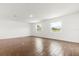 Living space with wood-look tile flooring and windows at 1062 Hidden Dr, Lakeland, FL 33809