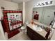 Bright bathroom features a granite vanity and a shower with modern fixtures at 112 Lake Tracy Ct, Haines City, FL 33844
