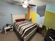 Comfortable bedroom with bright wall art, a ceiling fan, and lots of natural light at 112 Lake Tracy Ct, Haines City, FL 33844