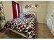 Inviting bedroom with patterned bedding, offering a comfortable and private retreat within the home at 112 Lake Tracy Ct, Haines City, FL 33844