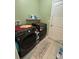 Laundry room with modern washer and dryer set, shelving, and tiled flooring, creating a functional space at 112 Lake Tracy Ct, Haines City, FL 33844