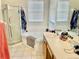 A well-lit bathroom features a shower stall, bathtub, and mirrored vanity for optimal functionality at 1137 Cherry Valley Way, Orlando, FL 32828