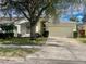 Charming single-Gathering home featuring a two-car garage and mature landscaping at 1137 Cherry Valley Way, Orlando, FL 32828