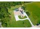 Stunning aerial view of home with pool, lush landscaping, and large driveway at 12177 Gray Birch Cir, Orlando, FL 32832