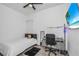 Simple bedroom featuring a modern decor, a desk, and a ceiling fan at 12177 Gray Birch Cir, Orlando, FL 32832