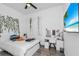 Stylish bedroom with a vanity, a TV, and modern decor, perfect for relaxation and entertainment at 12177 Gray Birch Cir, Orlando, FL 32832