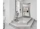 Bright foyer with a lion statue, large mirror, and porcelain tile flooring at 12177 Gray Birch Cir, Orlando, FL 32832